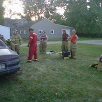 firefighters in green grass during training