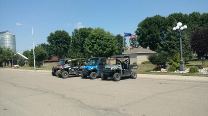 four wheelers lined up on street