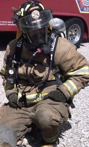 firefighter with uniform and gas mask on 